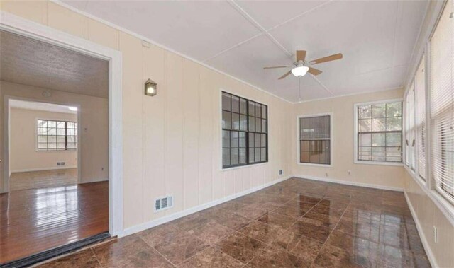 unfurnished sunroom with visible vents