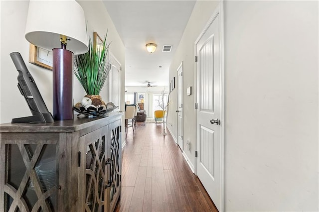 hallway featuring dark wood-type flooring