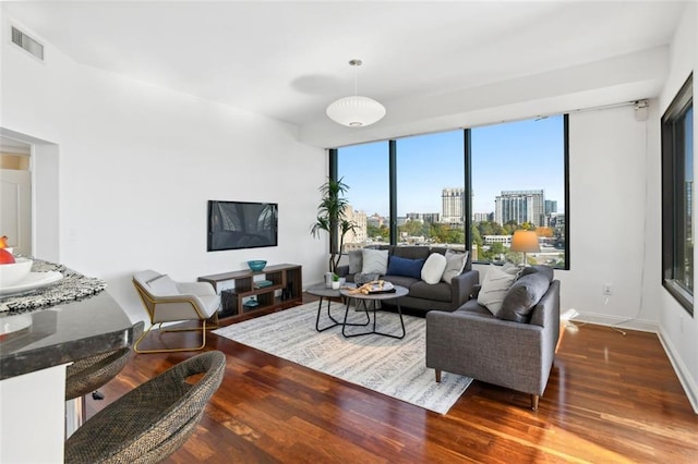 2828 Peachtree Rd NW Unit 1502, Atlanta, GA 30305 - living area with wood finished floors and floor to ceiling windows