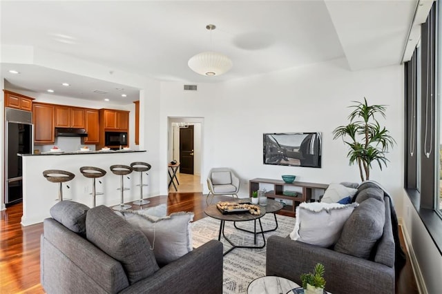 2828 Peachtree Rd NW Unit 1502, Atlanta, GA 30305 - living room with wood finished floors and recessed lighting