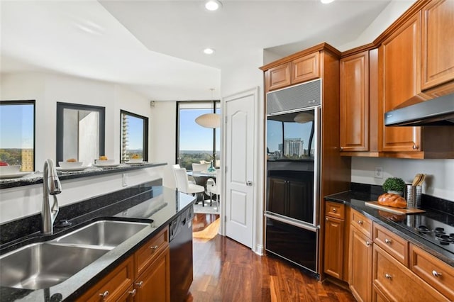 2828 Peachtree Rd NW Unit 1502, Atlanta, GA 30305 - kitchen with fridge, dishwasher, dark wood-style flooring, brown cabinets, and recessed lighting