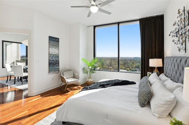 2828 Peachtree Rd NW Unit 1502, Atlanta, GA 30305 - bedroom featuring wood finished floors and ceiling fan