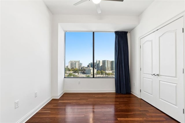 2828 Peachtree Rd NW Unit 1502, Atlanta, GA 30305 - unfurnished bedroom featuring wood finished floors and a ceiling fan