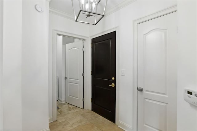 2828 Peachtree Rd NW Unit 1502, Atlanta, GA 30305 - entrance foyer featuring crown molding, a chandelier, and light tile patterned floors