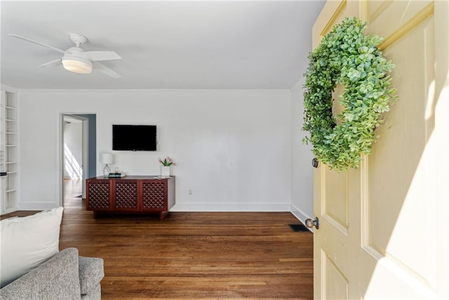 131 Lively St, Norcross, GA 30071 - living area with wood finished floors, a ceiling fan, baseboards, and ornamental molding