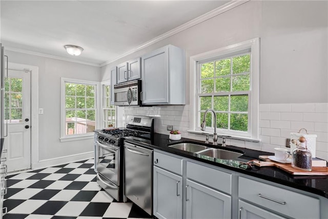 131 Lively St, Norcross, GA 30071 - kitchen with stainless steel appliances, a sink, dark floors, backsplash, and crown molding