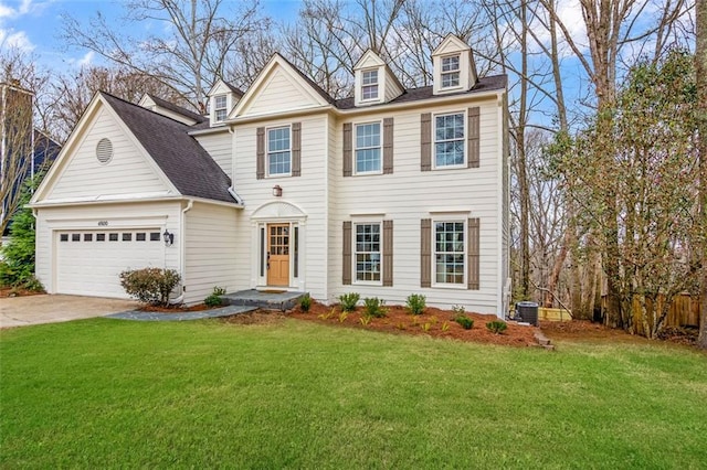 colonial house featuring a garage, concrete driveway, roof with shingles, a front lawn, and central AC