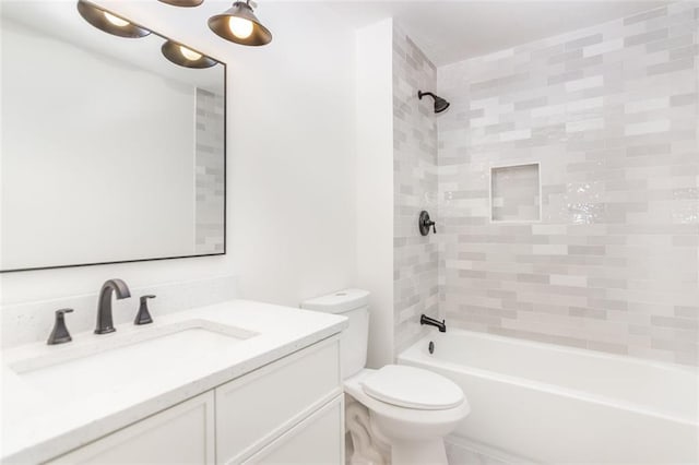 bathroom featuring shower / washtub combination, vanity, and toilet