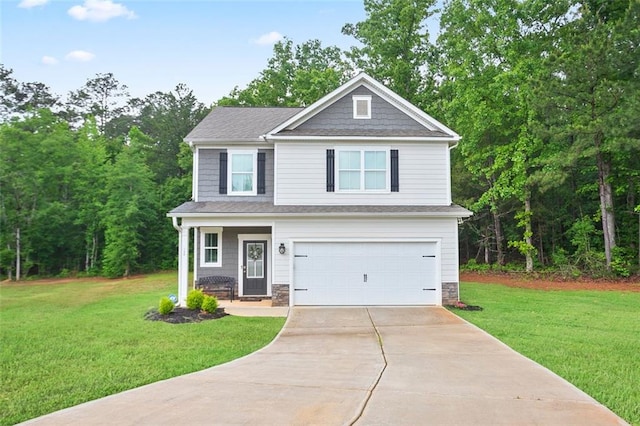 view of front of house with a garage, a front yard, driveway, and stone siding