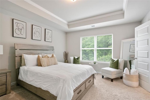 bedroom with carpet, crown molding, a raised ceiling, and baseboards