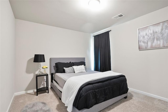 bedroom with carpet flooring and baseboards