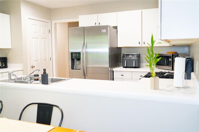 320 Kentshire, Lawrenceville, GA 30044 - kitchen with sink, stainless steel appliances, and white cabinets