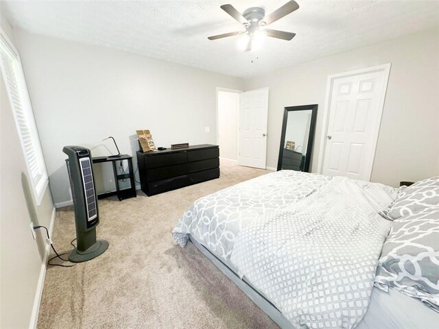 320 Kentshire, Lawrenceville, GA 30044 - carpeted bedroom with a textured ceiling and ceiling fan