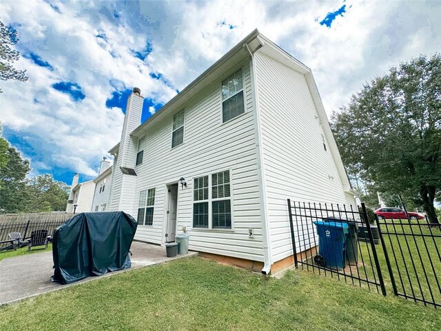 320 Kentshire, Lawrenceville, GA 30044 - rear view of property with a patio area and a lawn