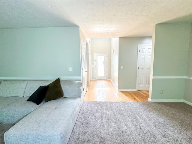 320 Kentshire, Lawrenceville, GA 30044 - living room featuring light colored carpet and a textured ceiling