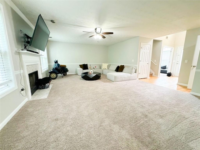 320 Kentshire, Lawrenceville, GA 30044 - living room with ceiling fan, light colored carpet, and a fireplace