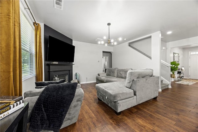 468 Lake Ridge Ln, Fairburn, GA 30213 - living area with stairway, hardwood / wood-style flooring, a chandelier, baseboards, and a glass covered fireplace