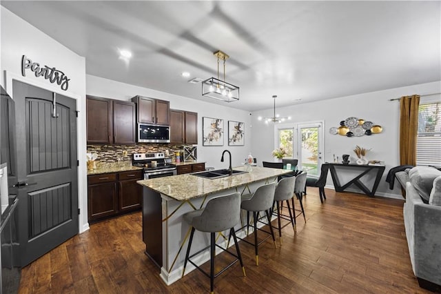468 Lake Ridge Ln, Fairburn, GA 30213 - kitchen with stainless steel appliances, a sink, a breakfast bar, and healthy amount of natural light