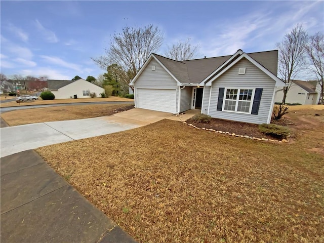 ranch-style home with a front yard, an attached garage, and driveway