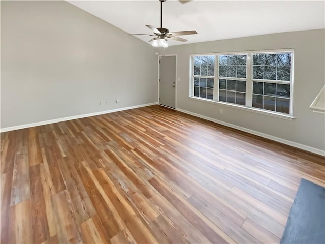 unfurnished room with wood finished floors, baseboards, and ceiling fan