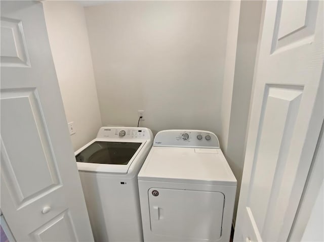 laundry room featuring washing machine and dryer and laundry area