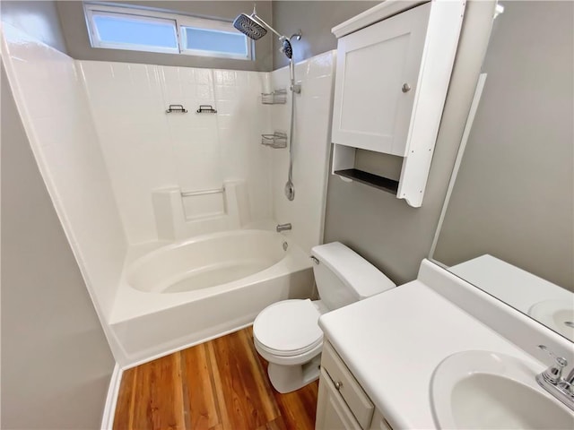 full bath with vanity, toilet, shower / bath combination, and wood finished floors