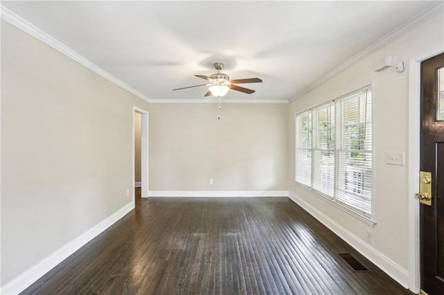 empty room with crown molding, baseboards, ceiling fan, and dark wood-type flooring