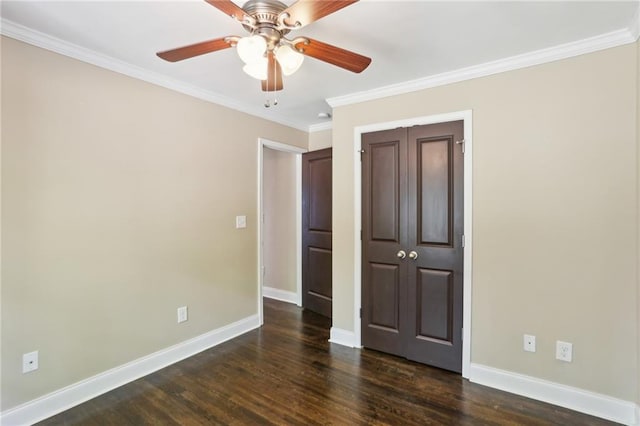 unfurnished room with a ceiling fan, crown molding, visible vents, dark wood-style flooring, and baseboards
