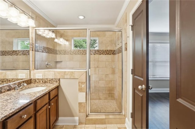bathroom featuring vanity, ornamental molding, and a stall shower