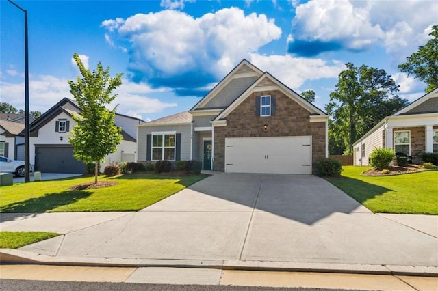 craftsman-style home featuring a garage and a front yard