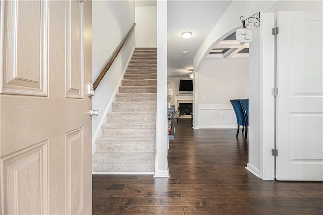 stairs featuring hardwood / wood-style floors