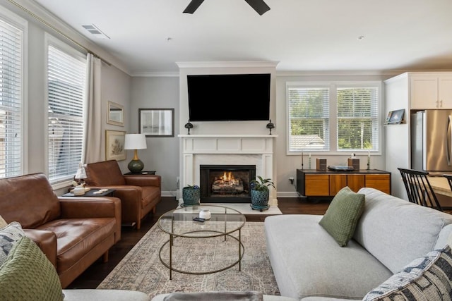 243 Retreat Ln, Canton, GA 30114 - living room featuring dark wood finished floors, a fireplace, ceiling fan, crown molding, and baseboards