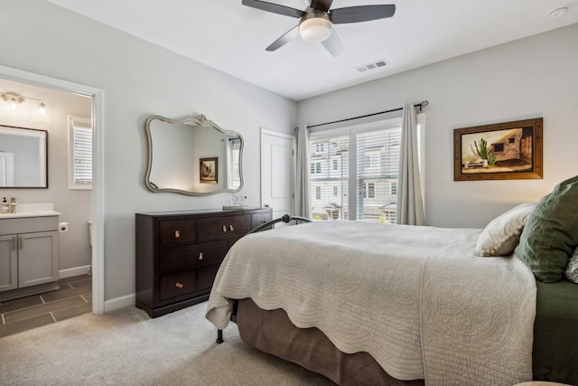 243 Retreat Ln, Canton, GA 30114 - bedroom with ensuite bathroom, light carpet, baseboards, and a ceiling fan