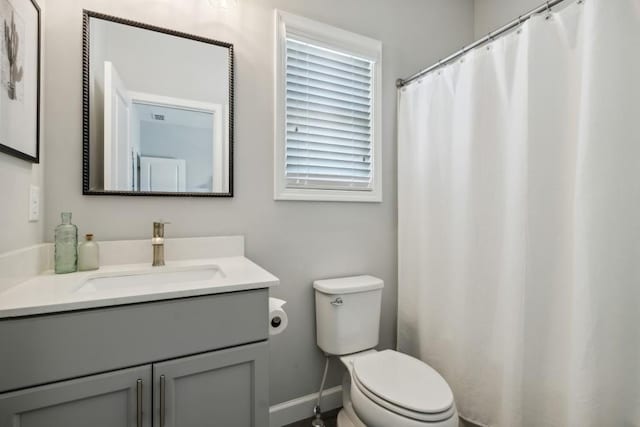 243 Retreat Ln, Canton, GA 30114 - full bathroom featuring vanity, toilet, baseboards, and curtained shower