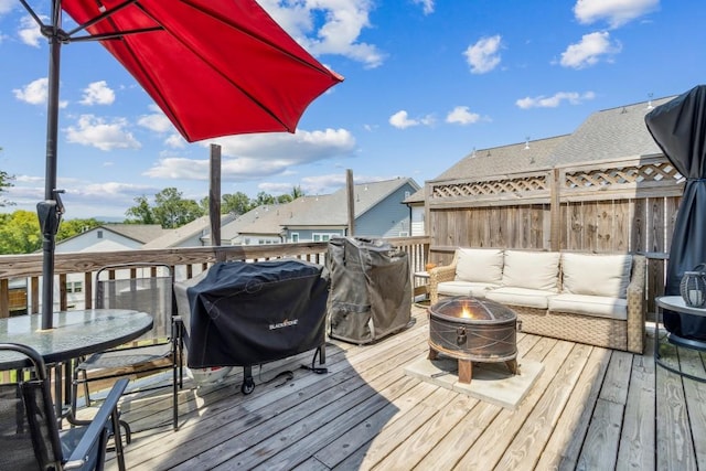 243 Retreat Ln, Canton, GA 30114 - wooden deck featuring outdoor dining space and an outdoor living space with a fire pit