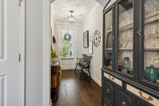 243 Retreat Ln, Canton, GA 30114 - entryway featuring arched walkways, ornamental molding, dark wood finished floors, and baseboards