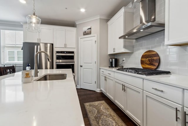 243 Retreat Ln, Canton, GA 30114 - kitchen with wall chimney exhaust hood, appliances with stainless steel finishes, crown molding, light countertops, and white cabinetry