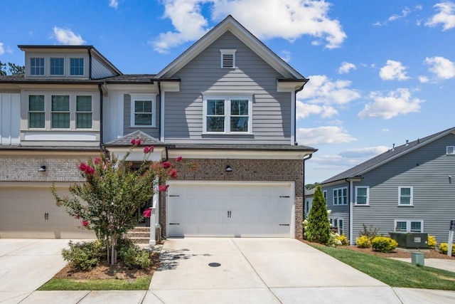 243 Retreat Ln, Canton, GA 30114 - view of front of home with an attached garage, concrete driveway, and brick siding