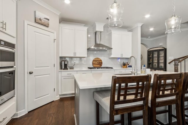 243 Retreat Ln, Canton, GA 30114 - kitchen featuring gas stovetop, light countertops, crown molding, decorative backsplash, and a kitchen bar