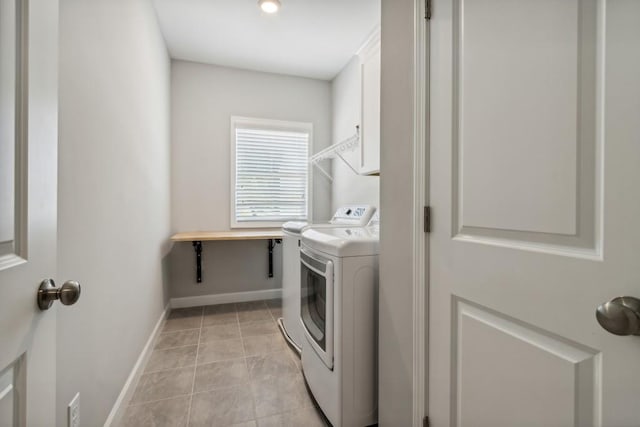 243 Retreat Ln, Canton, GA 30114 - laundry area with independent washer and dryer, light tile patterned floors, baseboards, and cabinet space