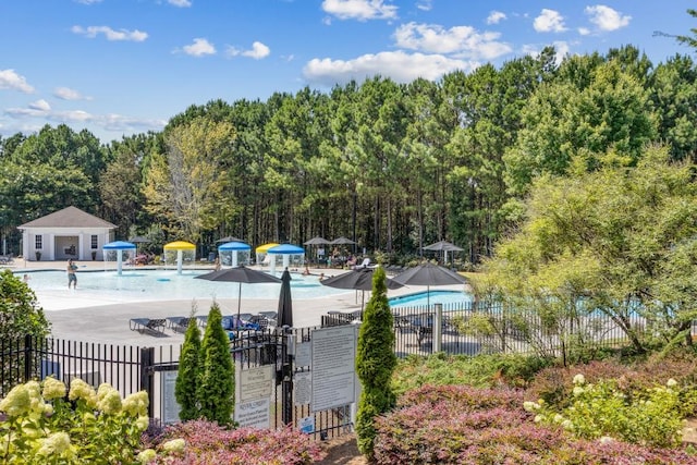 243 Retreat Ln, Canton, GA 30114 - community pool featuring a view of trees and a patio