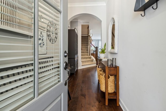 243 Retreat Ln, Canton, GA 30114 - entrance foyer featuring dark wood-type flooring, stairway, arched walkways, baseboards, and crown molding