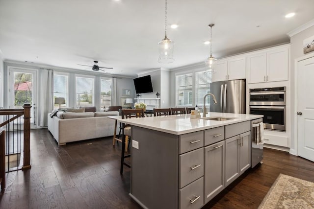 243 Retreat Ln, Canton, GA 30114 - kitchen with appliances with stainless steel finishes, crown molding, gray cabinets, plenty of natural light, and recessed lighting
