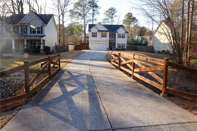 view of street with concrete driveway