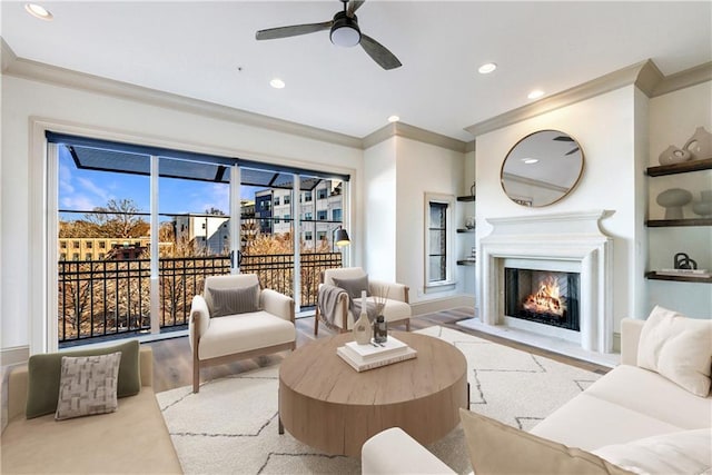 661 Auburn Ave NE Unit 10, Atlanta, GA 30312 - living room featuring ornamental molding, built in features, a warm lit fireplace, ceiling fan, and recessed lighting