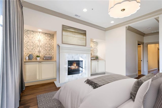 661 Auburn Ave NE Unit 10, Atlanta, GA 30312 - bedroom with a fireplace, dark wood-type flooring, crown molding, and recessed lighting