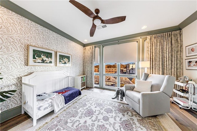 661 Auburn Ave NE Unit 10, Atlanta, GA 30312 - bedroom with wallpapered walls, wood finished floors, ornamental molding, ceiling fan, and recessed lighting