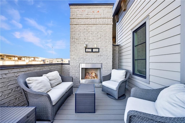 661 Auburn Ave NE Unit 10, Atlanta, GA 30312 - deck with an outdoor living space with a fireplace
