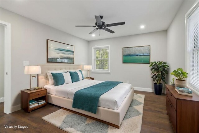 bedroom with ceiling fan and dark hardwood / wood-style floors