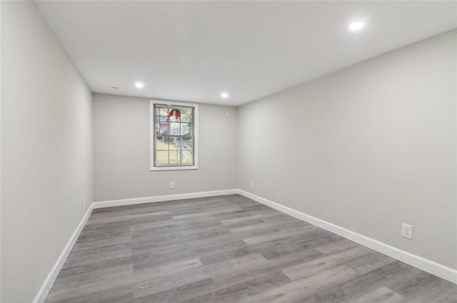 unfurnished room with light hardwood / wood-style flooring